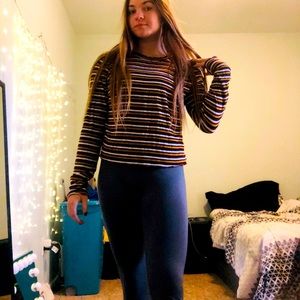Soft long sleeve, size L but fits like a S. No rips or stains.